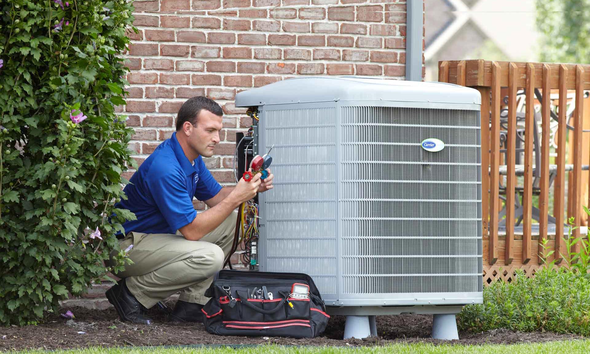 carrier-checking-gauges John’s Plumbing Heating Air Conditioning